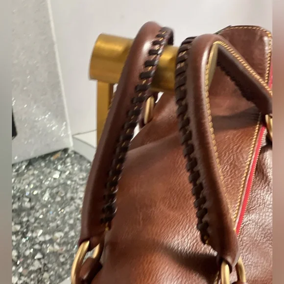 Dooney & Bourke florentina Italian Vacchetta leather handbag or crossbody